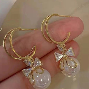 Boucles d'Oreilles Pendantes avec Noeud de Papillon et Perle