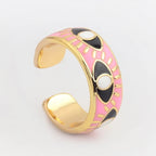 Verstellbarer Emaille-Ring mit blauem-Auge-Motiven in Gold und Rosa