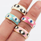 Verstellbarer Emaille-Ring mit blauem-Auge-Motiven in Gold und Weiß