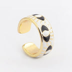 Verstellbarer Emaille-Ring mit blauem-Auge-Motiven in Gold und Weiß