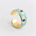 Verstellbarer Emaille-Ring mit blauem-Auge-Motiven in Gold und Blau