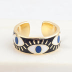 Verstellbarer Emaille-Ring mit blauem-Auge-Motiven in Gold und Schwarz