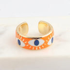 Verstellbarer Emaille-Ring mit blauem-Auge-Motiven in Gold und Orange