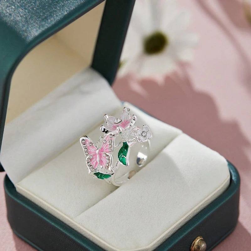 Adjustable cherry blossom and butterfly ring in silver