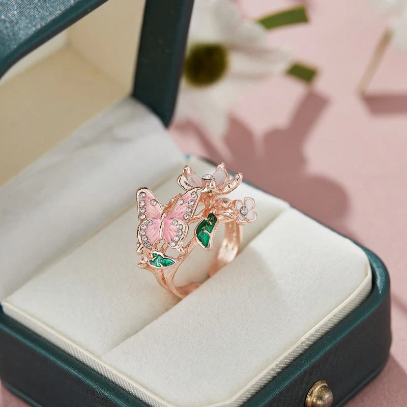 Adjustable cherry blossom and butterfly ring in rose gold