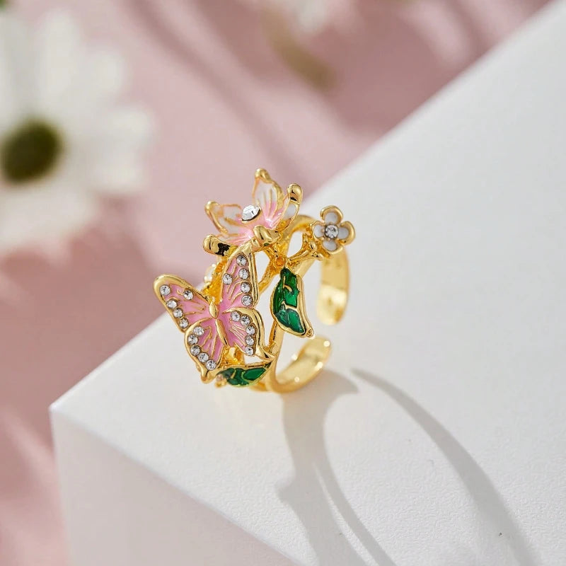 Adjustable cherry blossom and butterfly ring in gold