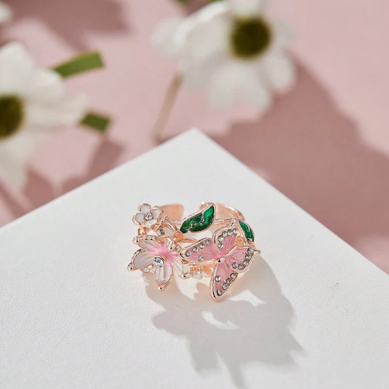 Adjustable cherry blossom and butterfly ring in rose gold