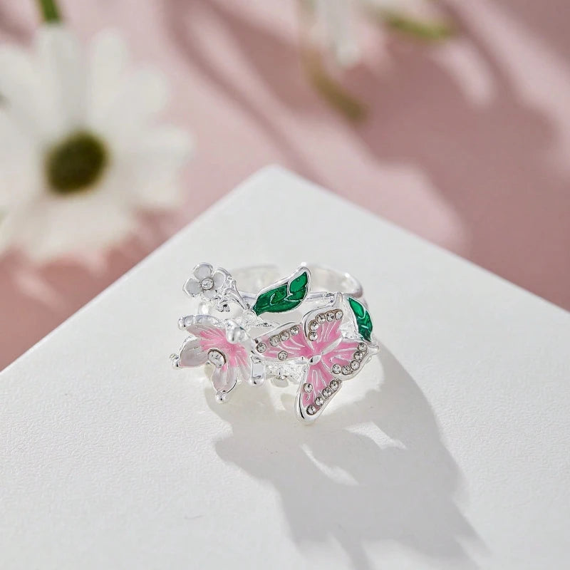 Adjustable cherry blossom and butterfly ring in silver