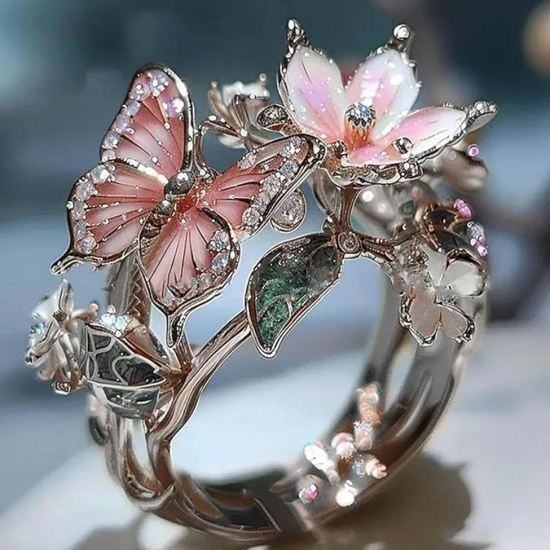 Adjustable cherry blossom and butterfly ring in silver