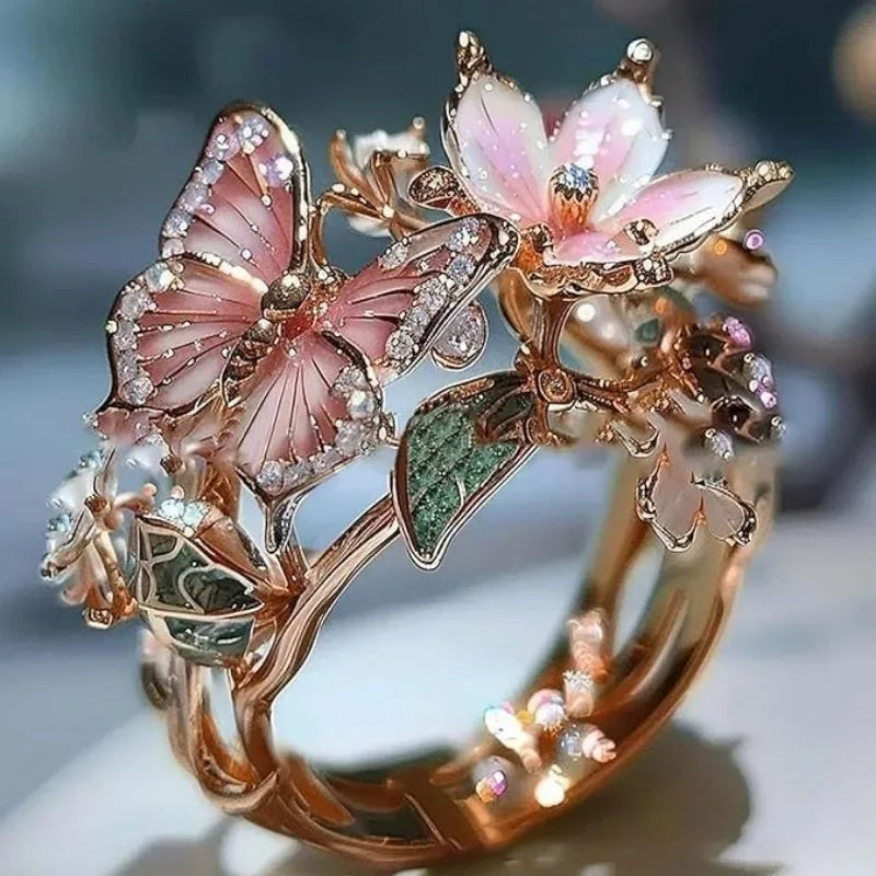 Adjustable cherry blossom and butterfly ring in gold
