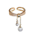 Bague avec perles suspendues