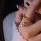 Bague avec perles suspendues
