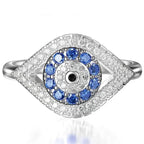 Bague en forme d'oeil pavé de cristaux et oeil bleu