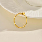 Fine wavy ring with its white crystal teardrop