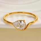 Fine wavy ring with its white crystal teardrop