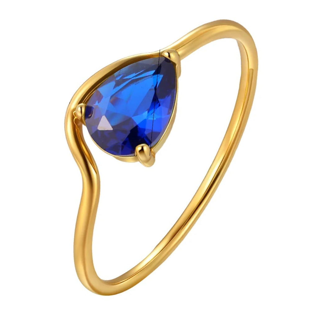 Fine wavy ring with its blue crystal teardrop