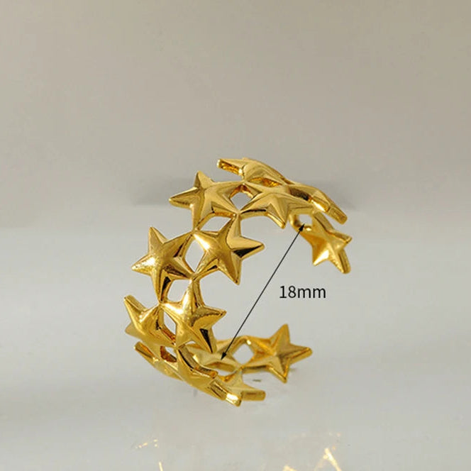 Anillo ancho multiestrellas de oro