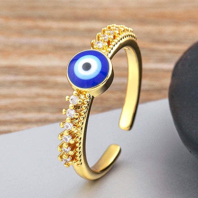 Bague ouverte pavée de cristaux avec incrustation oeil bleu