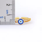 Bague ouverte pavée de cristaux avec incrustation oeil bleu
