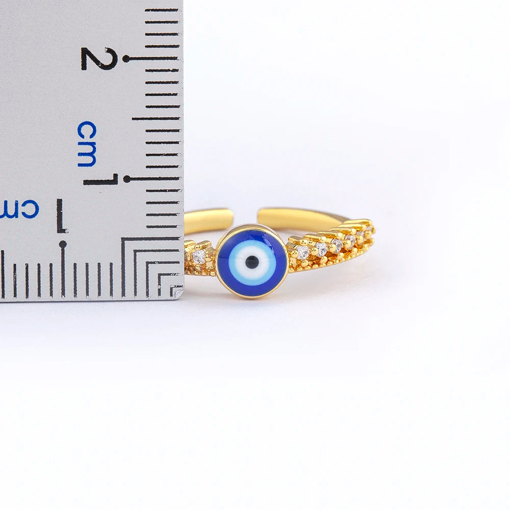 Bague ouverte pavée de cristaux avec incrustation oeil bleu