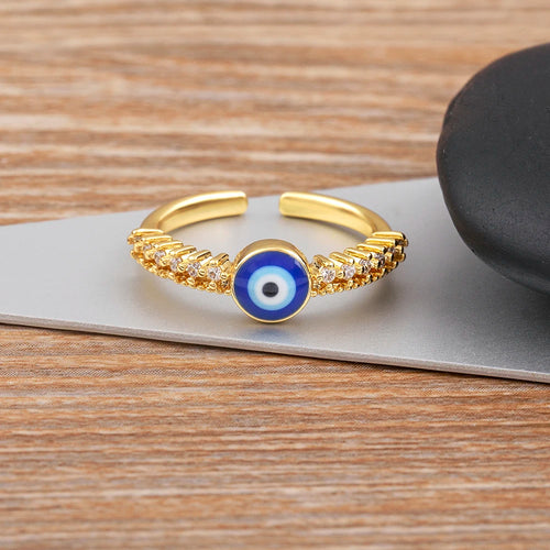Offener Ring mit pavé-gefassten Kristallen und blauer Augen-Einlage