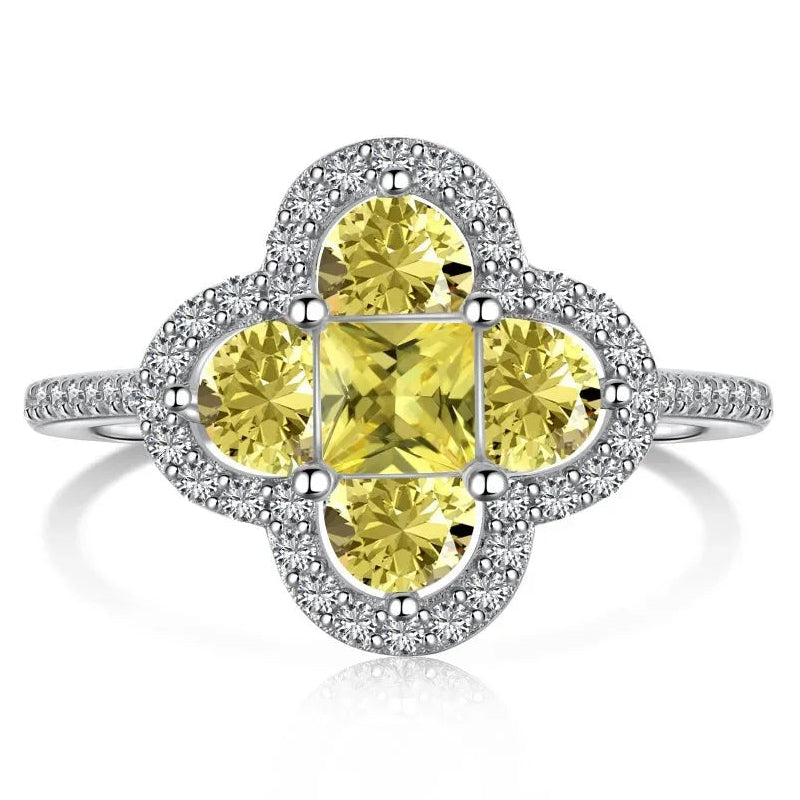 Anello quadrifoglio luminoso con cristalli argento e giallo
