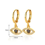 Boucles d'oreilles créoles avec pendentif oeil bleu orné de strass