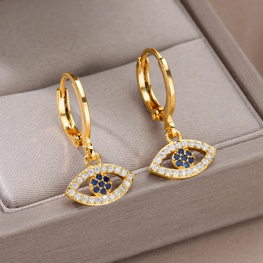 Boucles d'oreilles créoles avec pendentif oeil bleu orné de strass