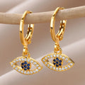 Boucles d'oreilles créoles avec pendentif oeil bleu orné de strass