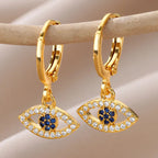Boucles d'oreilles créoles avec pendentif oeil bleu orné de strass