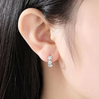 Hoop earrings with trio of flowers