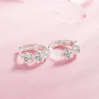 Hoop earrings with trio of flowers