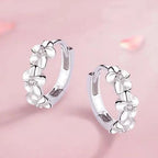 Hoop earrings with trio of flowers