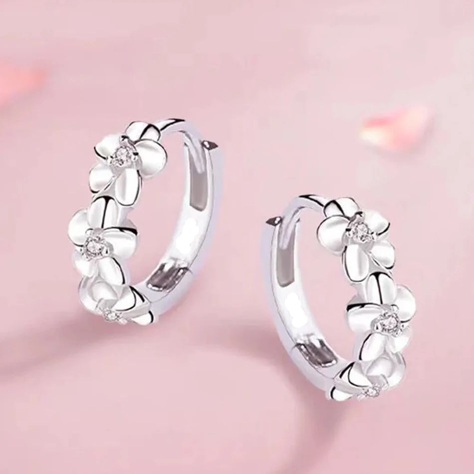 Hoop earrings with trio of flowers