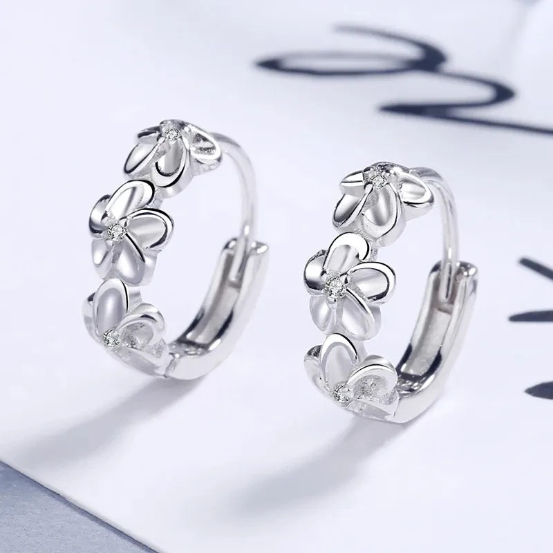 Hoop earrings with trio of flowers