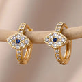 Boucles d'oreilles créoles oeil bleu incrusté de strass