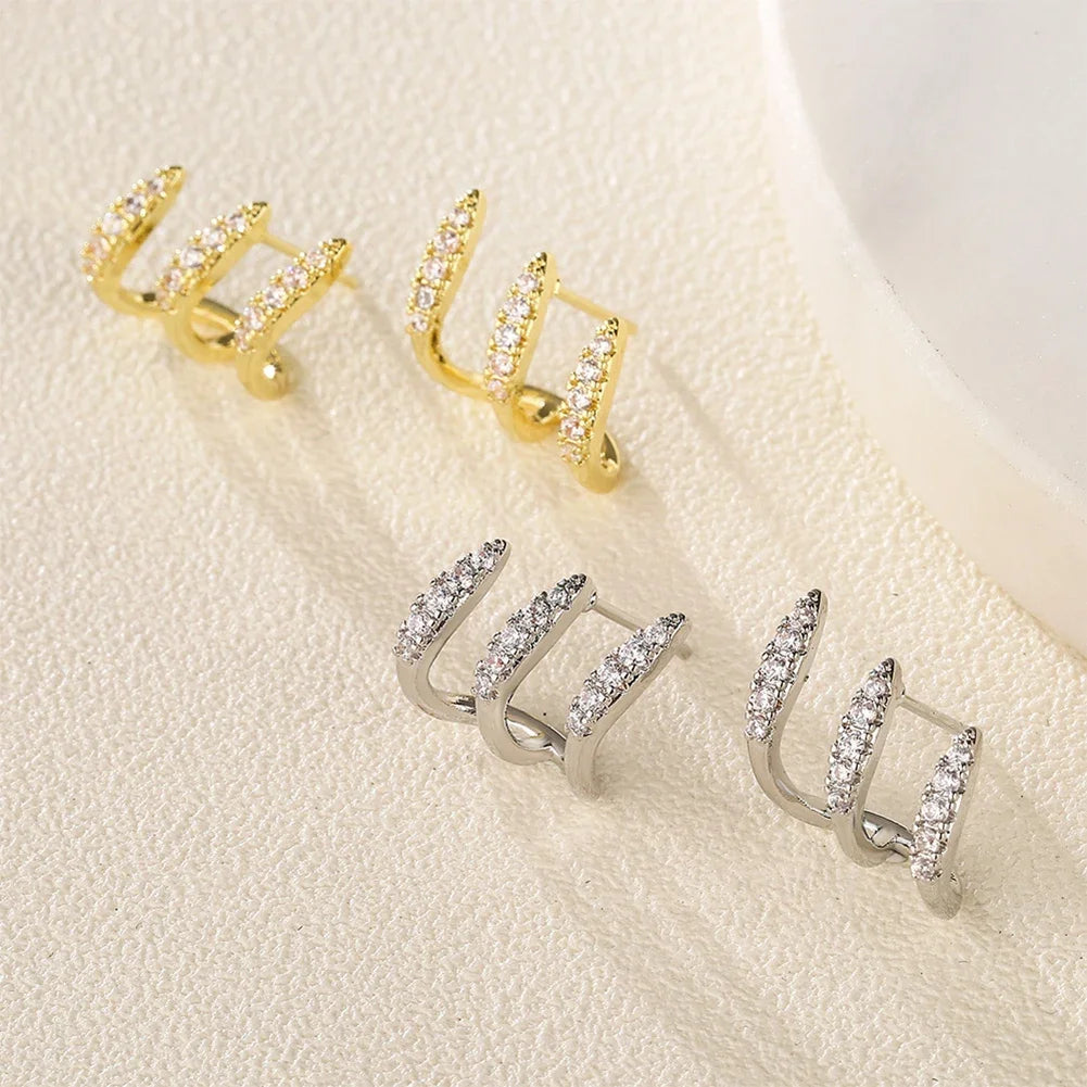 Boucles d'oreilles élégantes avec strass à trois griffes