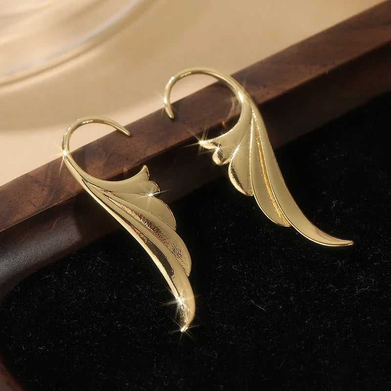 Boucles d'oreilles pendantes ailes d'ange femme or