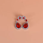 Drop earrings with large sparkling red teardrop crystal