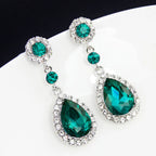 Drop earrings with large sparkling green teardrop crystal