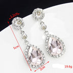 Drop earrings with large sparkling teardrop crystal