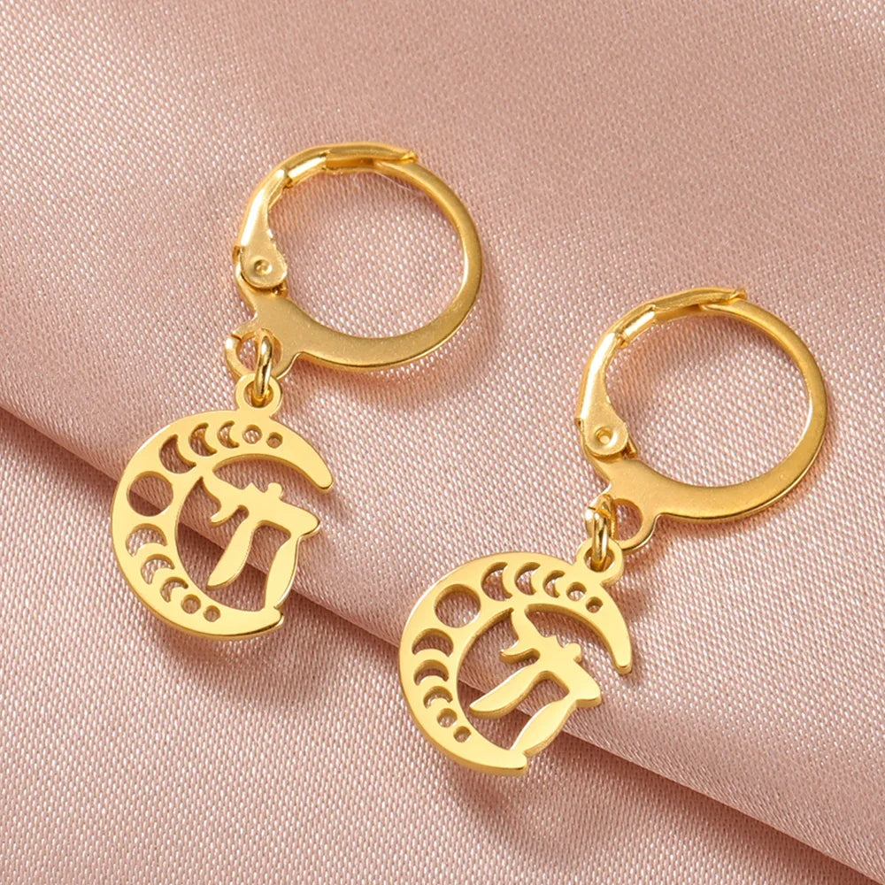 Dangling earrings with the Chai life symbol on a gold crescent moon