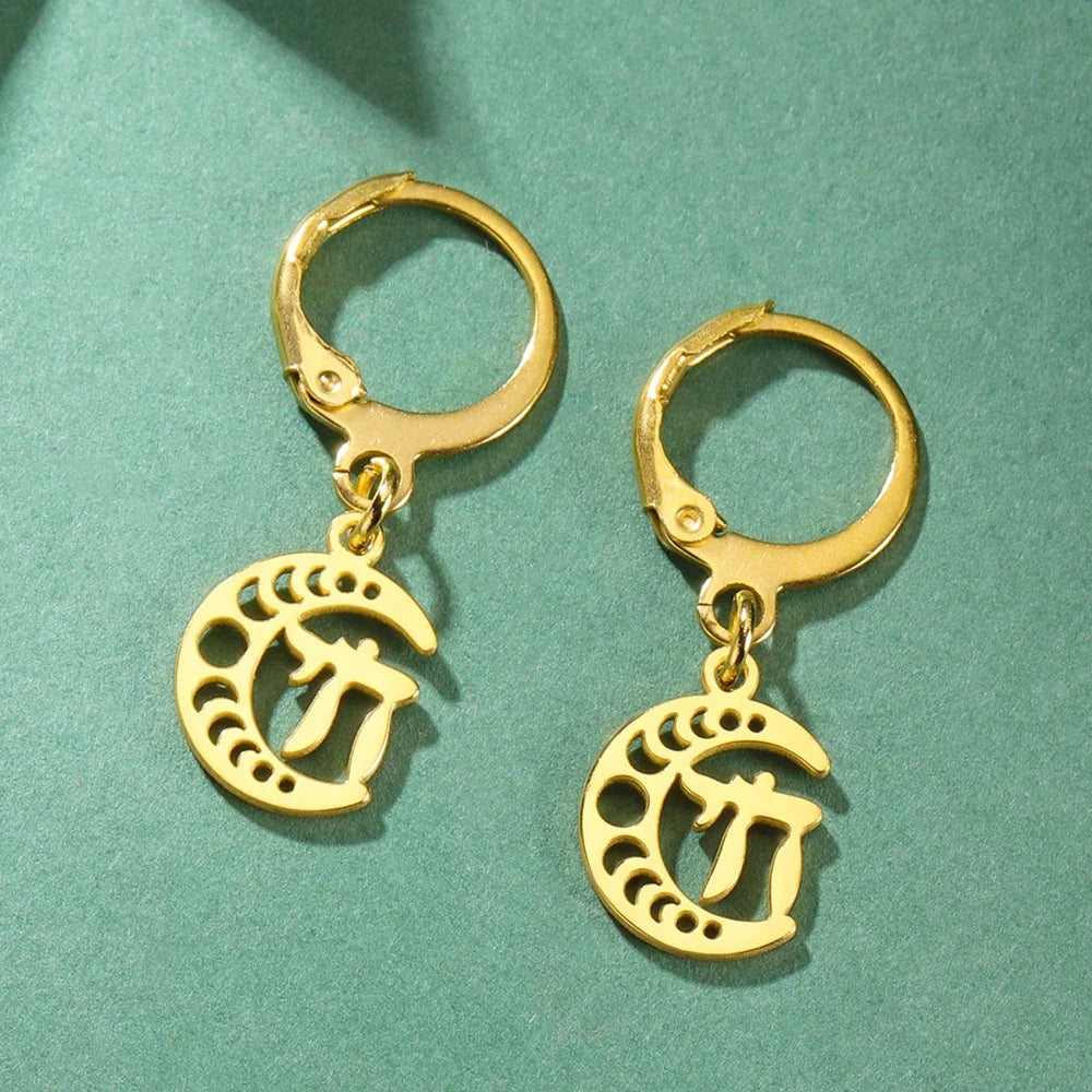 Dangling earrings with the Chai life symbol on a gold crescent moon