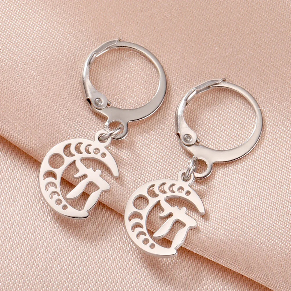 Dangling earrings with the Chai life symbol on a silver crescent moon