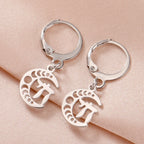 Dangling earrings with the Chai life symbol on a silver crescent moon