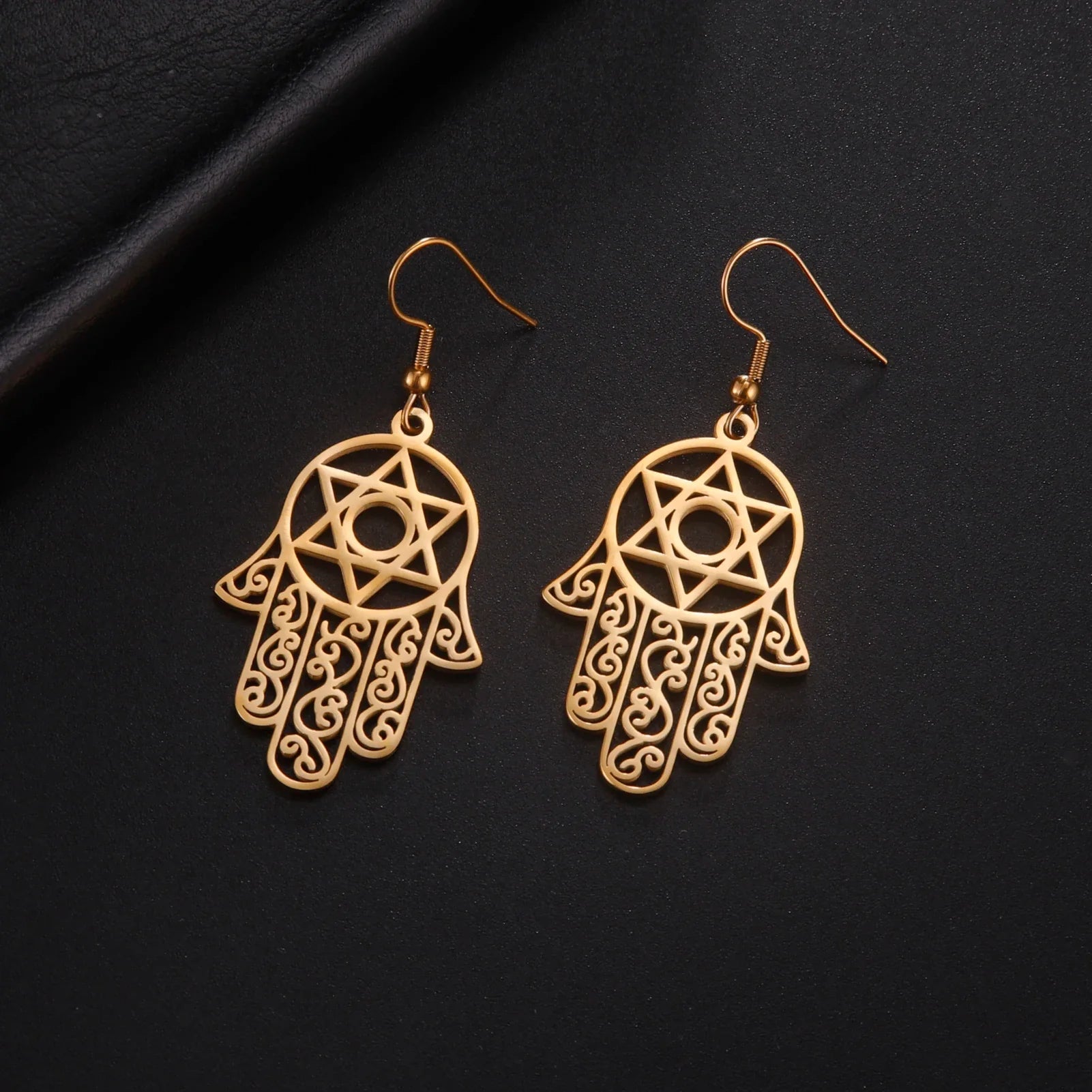 Dangling earrings with the Jewish protection symbol Fatma's hand and Star of David gold