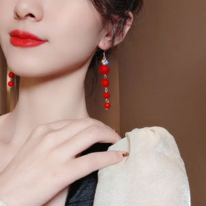 Boucles d'Oreilles Pendantes Boules de Noël Rouges Femme