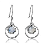 Boucles d'oreilles pendantes cercle entrelacé et pierre de lune
