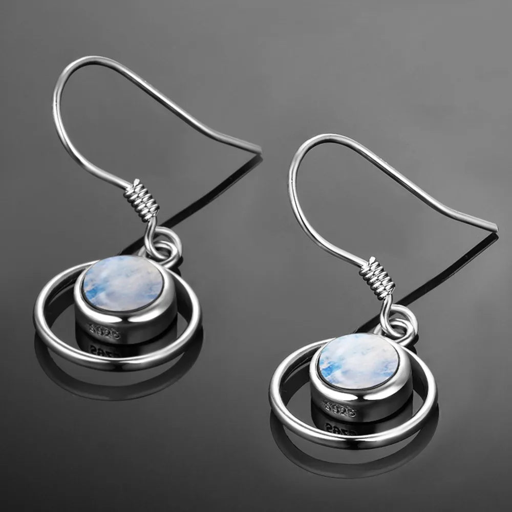 Boucles d'oreilles pendantes cercle entrelacé et pierre de lune