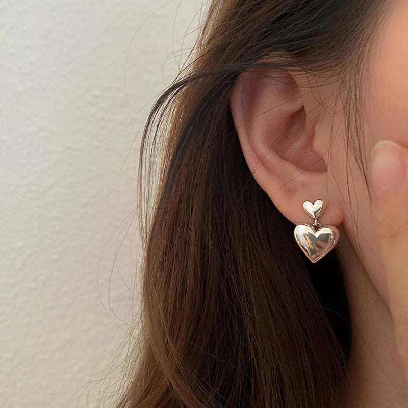 Orecchini pendenti argento/oro con ciondolo a forma di cuore Orecchini pendenti argento/oro con ciondolo a forma di cuore